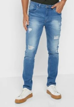 Rip And Repair Tapered Fit Jeans