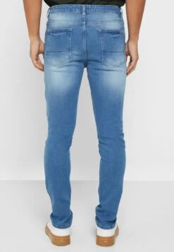 Rip And Repair Tapered Fit Jeans -Active Fashion Store 3 zoom desktop 1060
